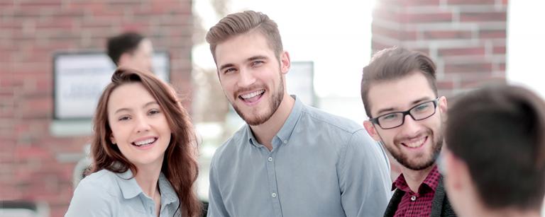 Stock image of two young people smiling at camera