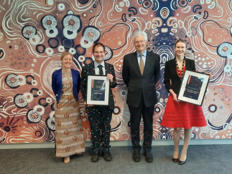 Photograph of co-founders Mr Andrew Pfeiffer and Ms Robin Edmonds receiving the Department of Prime Minister and Cabinet’s Secretary’s Excellence Award for Inclusion in 2022, for their work establishing the Community of Practice and advocating for neurodiversity inclusion across the APS.