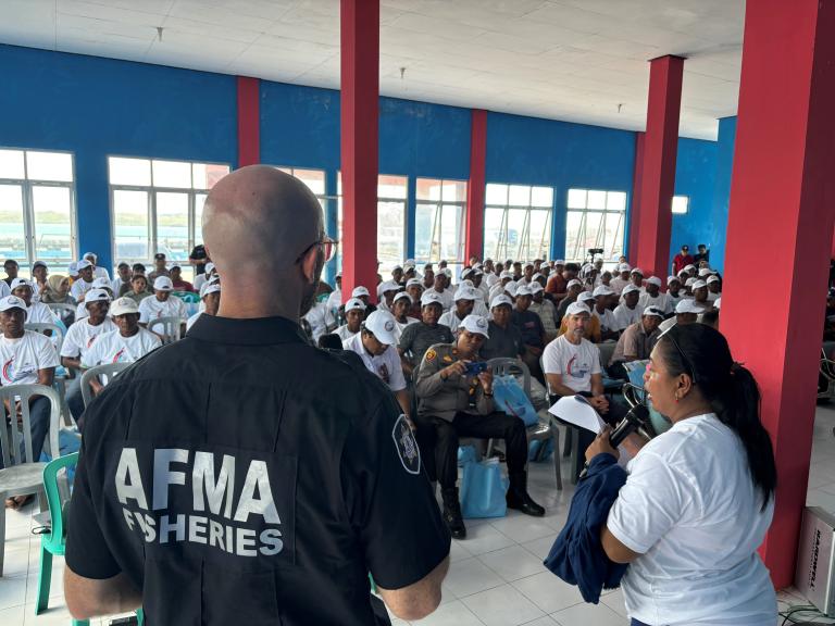 A photograph of staff from the Australian Fisheries Management Authority delivering a workshop to a fishing community in Indonesia