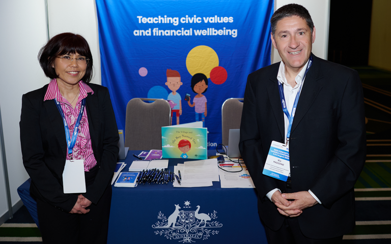 A photograph of Reeta Sidhu and Vic Mazzone from the ATO, at their information stand at a Principals Conference.