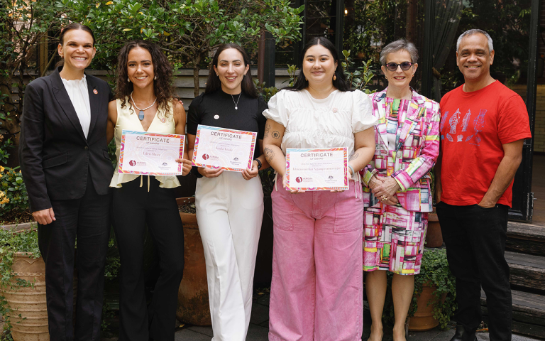 A photograph of the CEOs of the Aurora Education Foundation and Cancer Australia awarding 3 of the inaugural recipients of the First Nations Cancer Scholarship Program. 