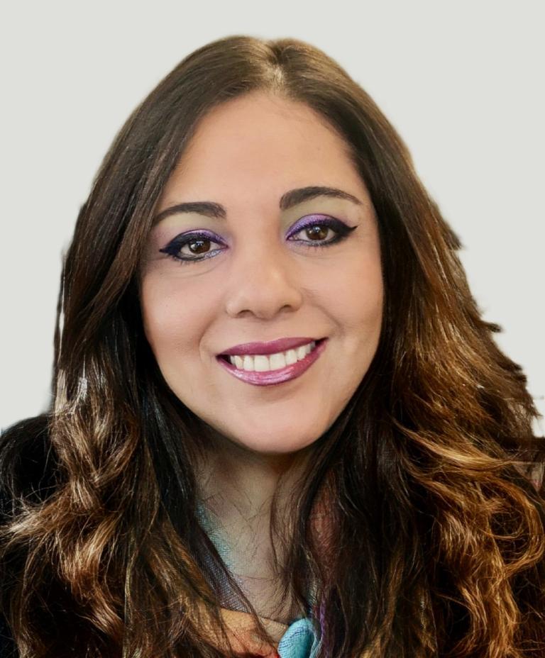 A head shot photograph of Salima Estefan, a member of the APS Procurement and Contract Management Profession. 