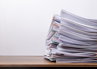 A stock photo of a stack of documents