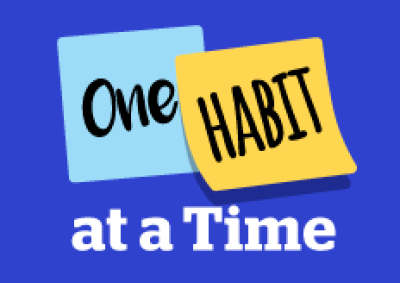 ‘one habit at a time’ on navy blue background