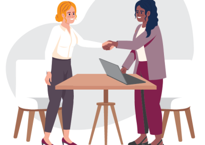 Illustration of two women shaking hands across a table with a laptop, representing a professional or business agreement. One woman has blonde hair and wears a white blouse with dark pants, while the other has dark hair and wears a purple blazer with matching pants.