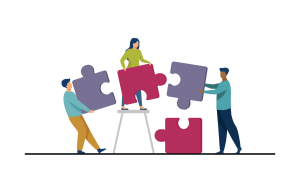 Team members with puzzle pieces working together